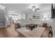 Open-concept living room flowing into a kitchen and dining area, featuring stylish furnishings at 33 Davidson St, Clayton, NC 27527