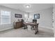 This office space has a large window, wooden desk, filing cabinet, and natural light at 33 Davidson St, Clayton, NC 27527
