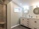 Modern bathroom with dual vanity, marble countertop, and glass-enclosed shower at 3421 Angus Rd, Durham, NC 27705