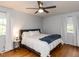 Relaxing bedroom with hardwood floors, ceiling fan, and natural light at 3421 Angus Rd, Durham, NC 27705