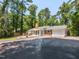 Exterior of home showing long driveway, garage, and backyard deck at 3421 Angus Rd, Durham, NC 27705