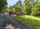 Exterior home view with driveway, lawn, and front facade at 3421 Angus Rd, Durham, NC 27705