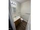 Bathroom with updated sink and toilet, plus towel bars at 3522 Ivy Commons Dr # 101, Raleigh, NC 27606