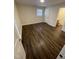 Bedroom with a window, door and wood-look floor at 3522 Ivy Commons Dr # 101, Raleigh, NC 27606