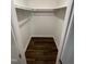 Walk-in closet features hardwood floors, white walls, and a hanging rod, offering ample storage space at 3522 Ivy Commons Dr # 101, Raleigh, NC 27606