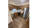 Well-lit kitchen features stainless steel appliances and ample cabinet space at 3522 Ivy Commons Dr # 101, Raleigh, NC 27606