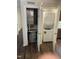 Laundry closet with water heater and stacked washer and dryer at 3522 Ivy Commons Dr # 101, Raleigh, NC 27606