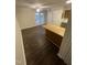 Bright open living area with wood floors and a kitchen bar at 3522 Ivy Commons Dr # 101, Raleigh, NC 27606