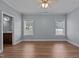 Bedroom with wood flooring, two windows, and view into an ensuite bathroom at 39 Mcguire Ln, Clayton, NC 27527