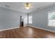 A cozy bedroom with a ceiling fan, hardwood floors, and natural light from the window at 39 Mcguire Ln, Clayton, NC 27527