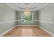 Dining room featuring a decorative chandelier and natural light through a window at 39 Mcguire Ln, Clayton, NC 27527