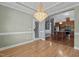 Dining room featuring a decorative chandelier with view to the kitchen at 39 Mcguire Ln, Clayton, NC 27527