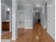 Bright hallway with hardwood floors leading to the bathroom and living room at 39 Mcguire Ln, Clayton, NC 27527