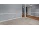 Spacious living room with plush carpeting, crown molding, and neutral paint at 39 Mcguire Ln, Clayton, NC 27527