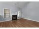 Cozy living room featuring a fireplace, hardwood floors, and ample natural light at 39 Mcguire Ln, Clayton, NC 27527