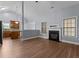 Open-concept living area featuring a fireplace and an eat-in kitchen at 39 Mcguire Ln, Clayton, NC 27527