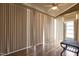 Light filled sun room with wood floors, ceiling fan and white vertical blinds at 39 Mcguire Ln, Clayton, NC 27527