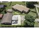 A captivating aerial view of a well-maintained property with lush greenery and a charming brick home at 403 E Mcpherson Dr, Mebane, NC 27302