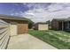 Outdoor space with a shed, partially fenced and open backyard, ready for outdoor activities and storage at 403 E Mcpherson Dr, Mebane, NC 27302
