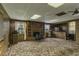 Spacious basement with a fireplace, bar, and multiple windows that offer a comfortable recreational space at 403 E Mcpherson Dr, Mebane, NC 27302