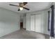 Light-filled bedroom with a ceiling fan, closet, and window offering a serene and comfortable space at 403 E Mcpherson Dr, Mebane, NC 27302