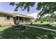 Well-manicured lawn and a brick home featuring a covered front porch at 403 E Mcpherson Dr, Mebane, NC 27302