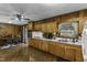 Open-concept kitchen with wood cabinets and adjacent dining area at 403 E Mcpherson Dr, Mebane, NC 27302