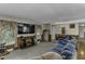 Bright living room with a large TV and plenty of comfortable seating at 403 E Mcpherson Dr, Mebane, NC 27302