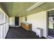 Enclosed sunroom with built-in storage, providing a versatile space with potential for various uses at 403 E Mcpherson Dr, Mebane, NC 27302