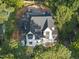 Aerial view of home under construction with stone and painted brick exterior, black frame windows, and professional landscaping at 5013 Coronado, Raleigh, NC 27609