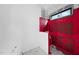 Bathroom construction with red waterproofing on shower walls, showing hexagon-tiled floor at 5013 Coronado, Raleigh, NC 27609