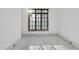 Sunlit bedroom with a large window, fresh white walls, and bright and airy, creating an inviting space at 5013 Coronado, Raleigh, NC 27609