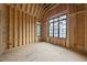Bedroom under construction with high ceilings, two windows, and natural light exposure at 5013 Coronado, Raleigh, NC 27609