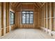 Spacious unfinished bedroom with large windows allowing ample natural light and backyard view at 5013 Coronado, Raleigh, NC 27609
