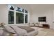 Modern bedroom featuring a large window, neutral decor, stylish furniture and a TV on the wall at 5013 Coronado, Raleigh, NC 27609
