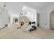 Spacious entryway under construction, featuring new stairs, archways, and abundant natural light at 5013 Coronado, Raleigh, NC 27609