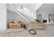 Bright entryway showcasing new stairs and modern architectural details, bathed in natural light at 5013 Coronado, Raleigh, NC 27609