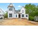 New home under construction featuring black window frames and an arched doorway at 5013 Coronado, Raleigh, NC 27609