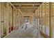 Long hallway framed in wood, showcasing the layout and potential flow of the new home at 5013 Coronado, Raleigh, NC 27609
