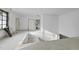 Hallway featuring fresh white walls, newly installed window, doors and bright natural light at 5013 Coronado, Raleigh, NC 27609