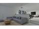 Modern living room features a comfortable gray sofa, stylish decor, and an inviting open-concept design at 5013 Coronado, Raleigh, NC 27609