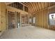 Framed-out room with high ceilings and view of another room in a new construction home at 5013 Coronado, Raleigh, NC 27609
