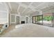 Open living room layout featuring fireplace and access to outdoor area, walls are in process of drywall at 5013 Coronado, Raleigh, NC 27609
