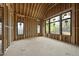 Spacious room framed with large windows offering great natural light in a new construction home at 5013 Coronado, Raleigh, NC 27609