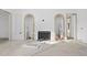 Open floor plan featuring arched doorways, a fireplace and modern design at 5013 Coronado, Raleigh, NC 27609