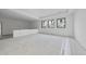 Bright living room with large windows, and modern lighting at 5013 Coronado, Raleigh, NC 27609