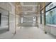 Bright room with multiple windows, walls are in process of drywall, work in progress at 5013 Coronado, Raleigh, NC 27609