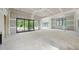 Large living room with sliding glass doors and view of backyard, walls are in process of drywall at 5013 Coronado, Raleigh, NC 27609