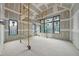 Bright room with multiple windows, walls are in process of drywall, work in progress at 5013 Coronado, Raleigh, NC 27609