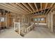Unfinished living room with exposed wood framework, large windows, and open floor plan awaiting your design at 5013 Coronado, Raleigh, NC 27609